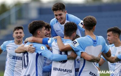 Los jugadores del Malagueño celebran uno de los tantos de Mini (Foto: Málaga CF).