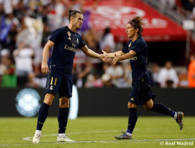 Bale celebra con Modric su gol ante el Arsenal (Foto: Real Madrid).