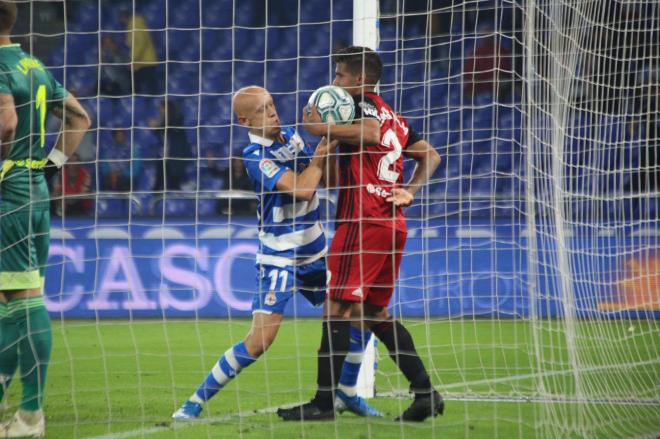 Víctor Mollejo y Carlos Julio, en una acción del Deporte-Mirandés (Foto: Iris Miquel).