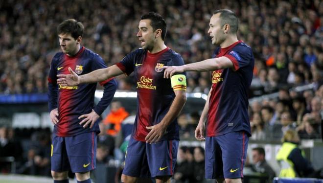 Messi, Xavi e Iniesta, en un partido del Barcelona.