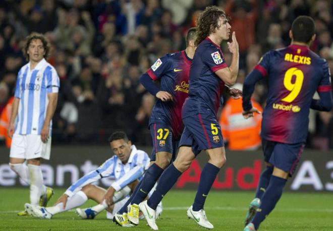 Puyol, celebrando un gol al Málaga en el Camp Nou (Foto: EFE).