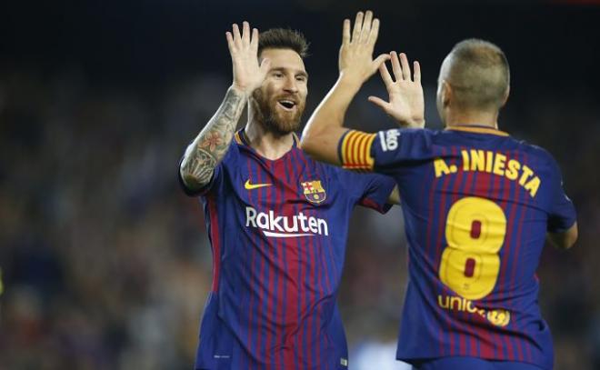 Iniesta y Messi celebrando un gol ante el Málaga.