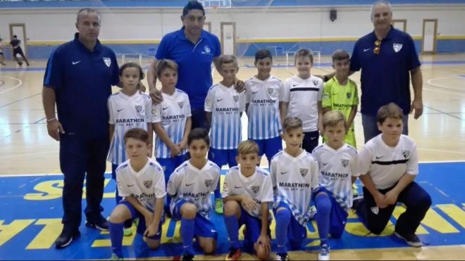 Basti posa con el primer equipo del Málaga de Fútbol Sala.