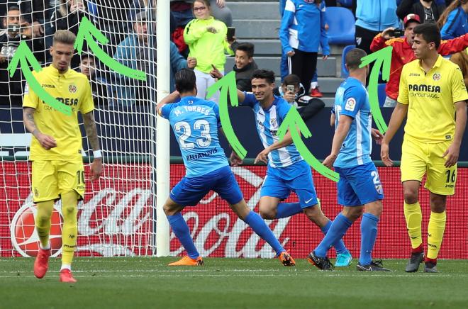 Varios aficionados, grabando el gol.