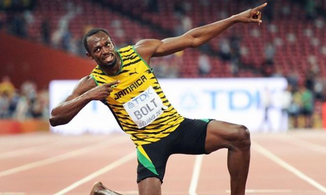Usain Bolt posando tras una de sus victorias.