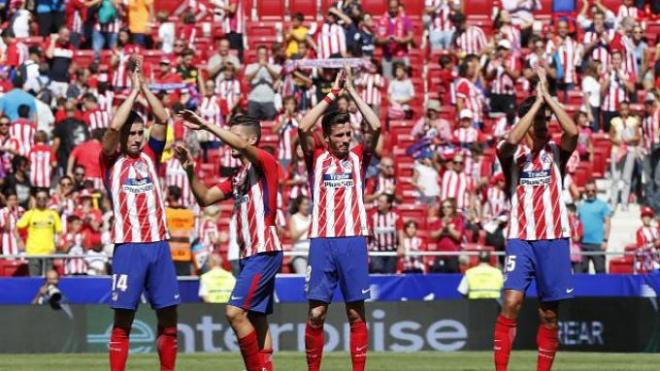 Los jugadores del Atlético celebran el triunfo.